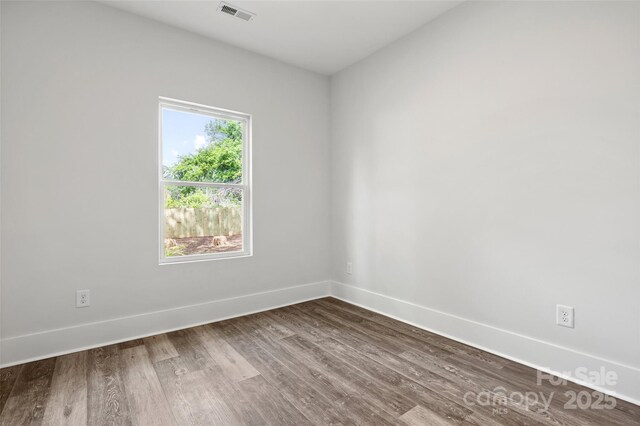 508 Clegg St, Shelby, NC 28150 - spare room featuring visible vents, baseboards, and dark wood-style floors