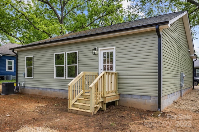 508 Clegg St, Shelby, NC 28150 - back of house with central air condition unit, a shingled roof, and crawl space