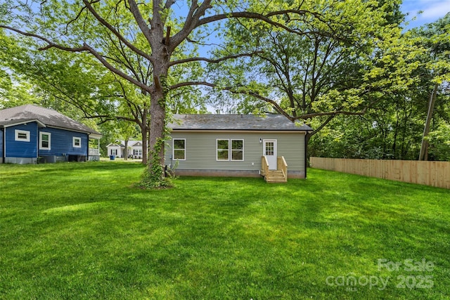 508 Clegg St, Shelby, NC 28150 - back of property featuring entry steps, fence, and a lawn
