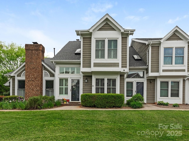 8251 Tradd Ct, Charlotte, NC 28210 - view of front of home with a front lawn and roof with shingles