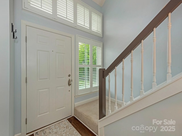 8251 Tradd Ct, Charlotte, NC 28210 - foyer featuring dark wood-style floors, stairway, and baseboards