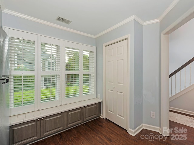 8251 Tradd Ct, Charlotte, NC 28210 - entrance foyer with dark wood finished floors, crown molding, baseboards, and stairway