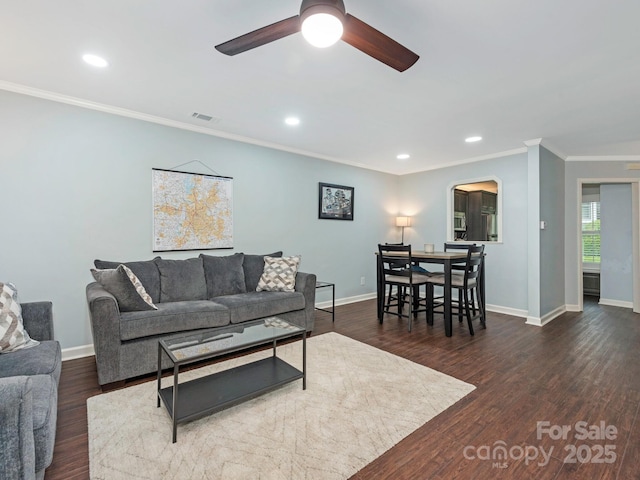 8251 Tradd Ct, Charlotte, NC 28210 - living room with ornamental molding, a ceiling fan, arched walkways, baseboards, and recessed lighting