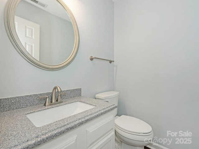 8251 Tradd Ct, Charlotte, NC 28210 - half bath featuring toilet and vanity