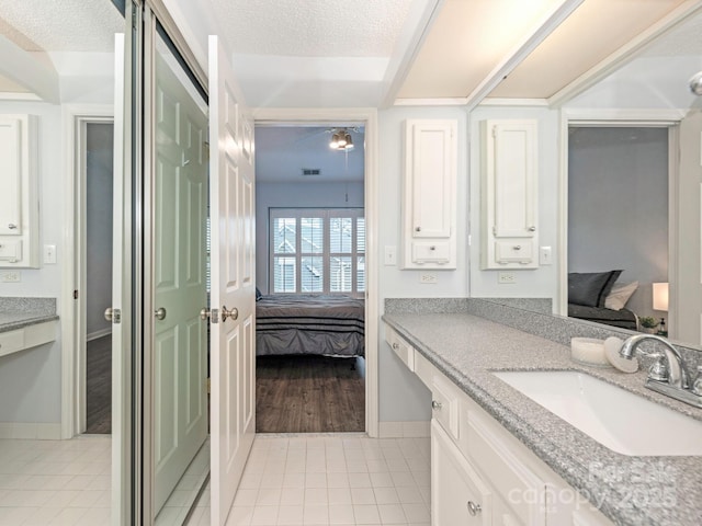8251 Tradd Ct, Charlotte, NC 28210 - ensuite bathroom with vanity, tile patterned flooring, and baseboards