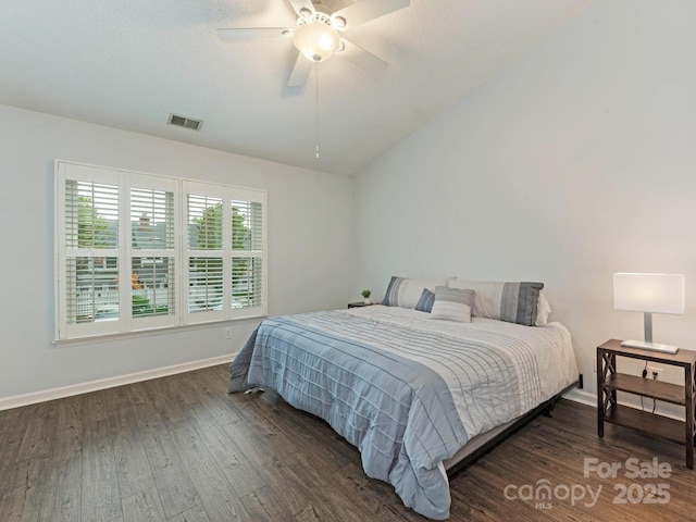 8251 Tradd Ct, Charlotte, NC 28210 - bedroom with dark wood-type flooring, vaulted ceiling, baseboards, and ceiling fan