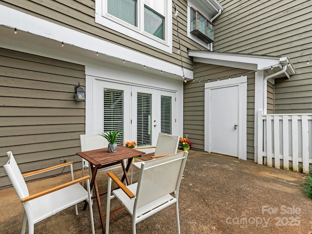 8251 Tradd Ct, Charlotte, NC 28210 - view of patio / terrace with french doors and outdoor dining space