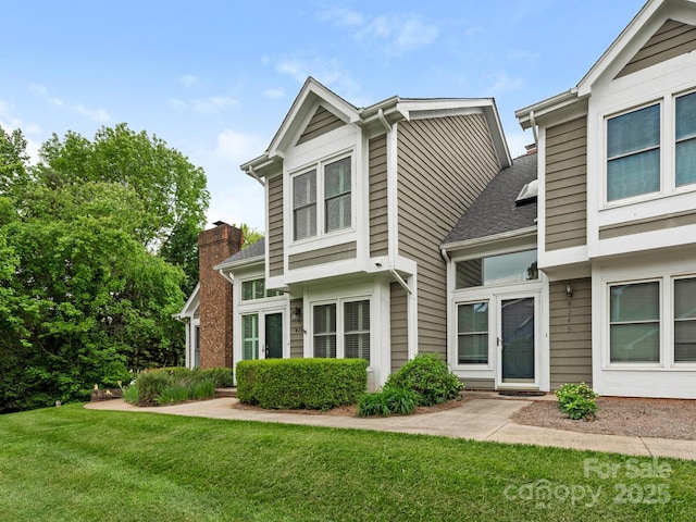 8251 Tradd Ct, Charlotte, NC 28210 - view of front of house with a front yard and a shingled roof