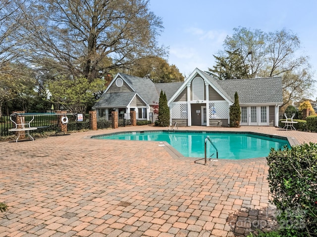 8251 Tradd Ct, Charlotte, NC 28210 - community pool featuring a patio and french doors