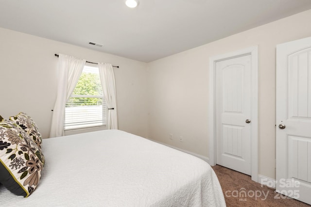 bedroom featuring carpet flooring, visible vents, and baseboards