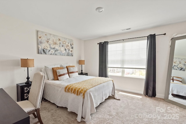 bedroom with baseboards, visible vents, and carpet flooring