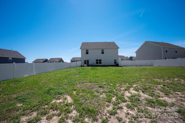 view of yard with a fenced backyard