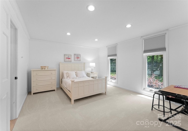 bedroom with light colored carpet, recessed lighting, and baseboards