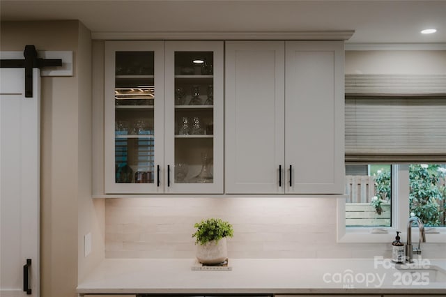 bar featuring decorative backsplash and recessed lighting