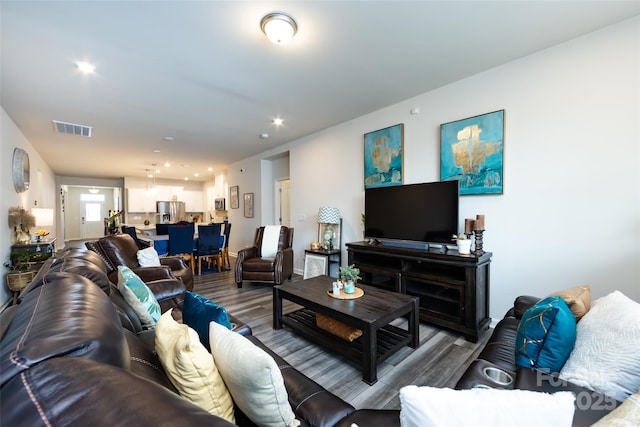 3100 Cheyney Park Dr, Charlotte, NC 28269 - living room with recessed lighting, visible vents, and wood finished floors