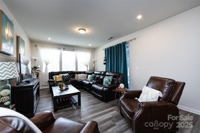 3100 Cheyney Park Dr, Charlotte, NC 28269 - living room featuring wood finished floors, baseboards, and visible vents