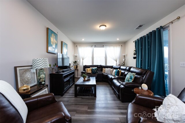 3100 Cheyney Park Dr, Charlotte, NC 28269 - living room featuring dark wood finished floors and visible vents