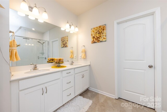 3100 Cheyney Park Dr, Charlotte, NC 28269 - full bath featuring a stall shower, double vanity, a sink, and baseboards