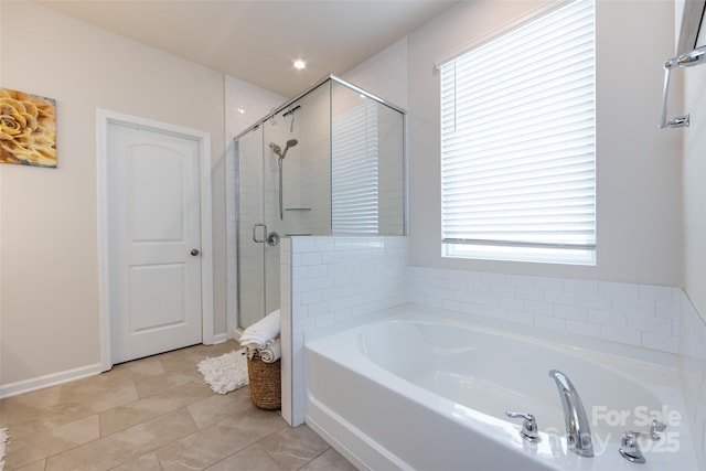 3100 Cheyney Park Dr, Charlotte, NC 28269 - bathroom featuring a stall shower, a garden tub, baseboards, and tile patterned floors