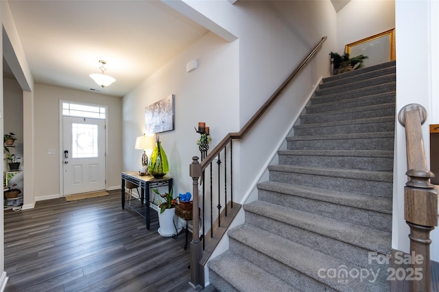 3100 Cheyney Park Dr, Charlotte, NC 28269 - entryway with baseboards, wood finished floors, and stairs