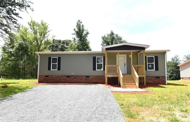 828 Long Bow Rd, Salisbury, NC 28144 - view of front of house featuring crawl space, a porch, driveway, and a front lawn