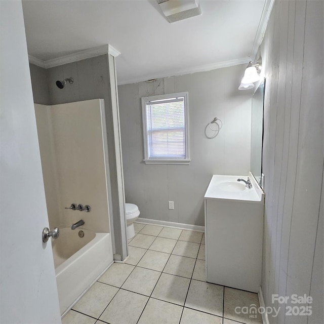 full bathroom featuring crown molding, toilet, vanity,  shower combination, and tile patterned flooring
