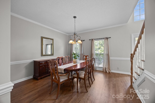 9000 Stourbridge Dr, Huntersville, NC 28078 - dining space featuring stairway, baseboards, wood finished floors, and a notable chandelier
