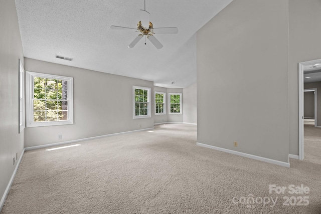 9000 Stourbridge Dr, Huntersville, NC 28078 - unfurnished room with visible vents, carpet floors, lofted ceiling, baseboards, and ceiling fan