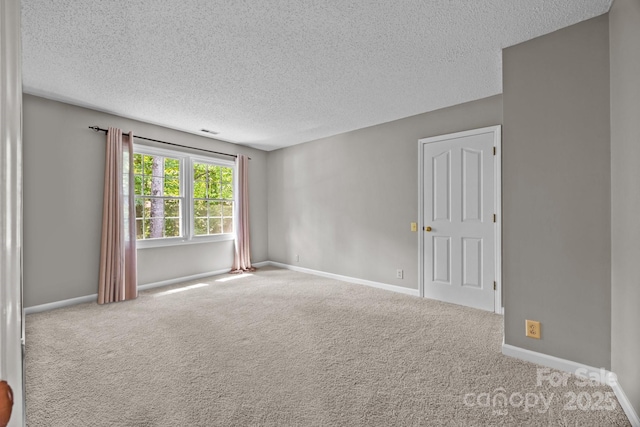 9000 Stourbridge Dr, Huntersville, NC 28078 - carpeted empty room with a textured ceiling and baseboards