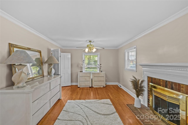 6035 Idlebrook Dr, Charlotte, NC 28212 - living area featuring a fireplace, crown molding, ceiling fan, and light wood-style floors