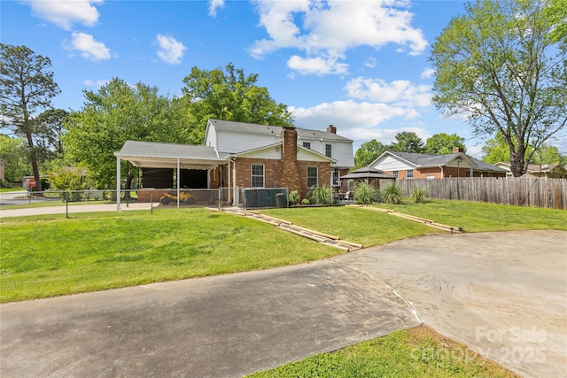 6035 Idlebrook Dr, Charlotte, NC 28212 - view of front of home featuring driveway, brick siding, a carport, and a chimney