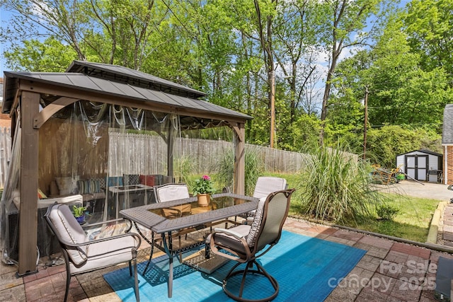 6035 Idlebrook Dr, Charlotte, NC 28212 - view of patio / terrace with a gazebo, a storage shed, and outdoor dining area