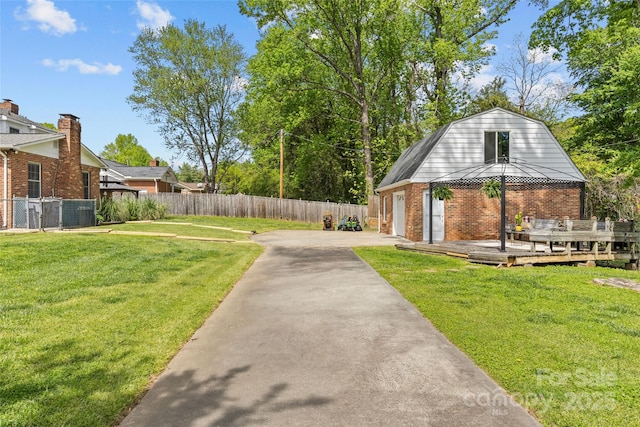 6035 Idlebrook Dr, Charlotte, NC 28212 - view of yard featuring a wooden deck, a gazebo, and a garage