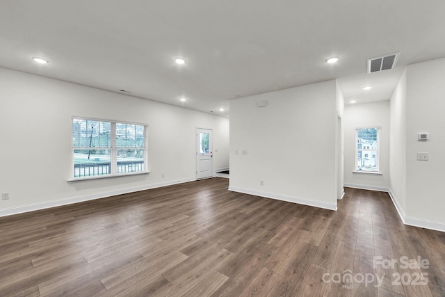 81 Walnut Springs Dr Unit 22-D, Asheville, NC 28804 - unfurnished room featuring recessed lighting, dark wood-style floors, visible vents, and plenty of natural light