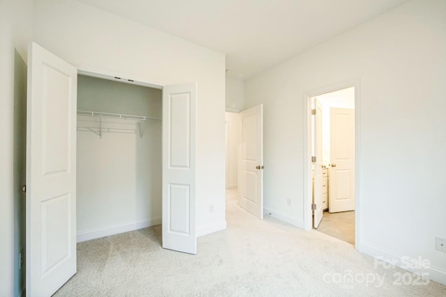 81 Walnut Springs Dr Unit 22-D, Asheville, NC 28804 - unfurnished bedroom with a closet, light colored carpet, and baseboards