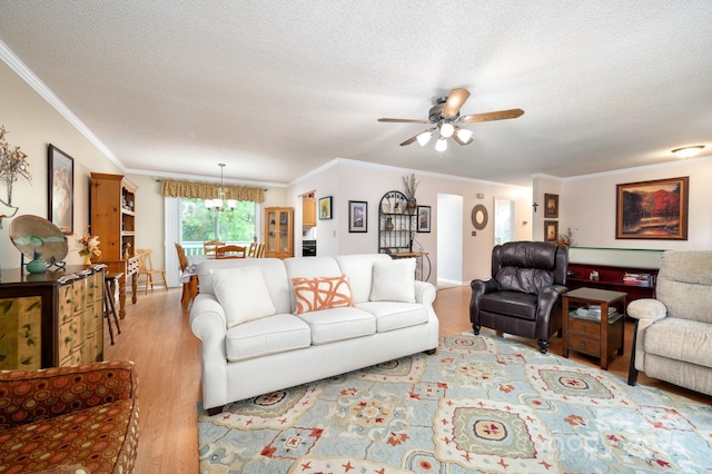 15 Heather Ln, Fairview, NC 28730 - living area featuring crown molding, a ceiling fan, wood finished floors, a textured ceiling, and a chandelier