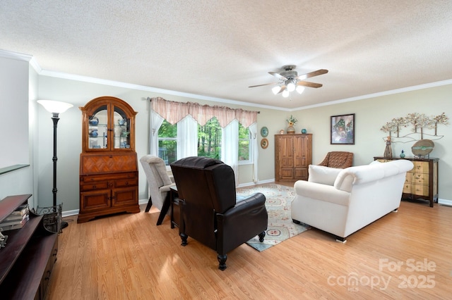 15 Heather Ln, Fairview, NC 28730 - living area with light wood finished floors, a textured ceiling, a ceiling fan, crown molding, and baseboards
