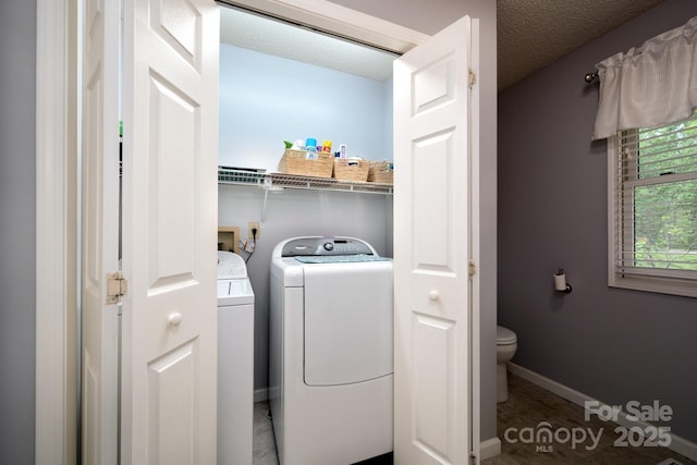 15 Heather Ln, Fairview, NC 28730 - laundry room featuring independent washer and dryer, baseboards, and a textured ceiling