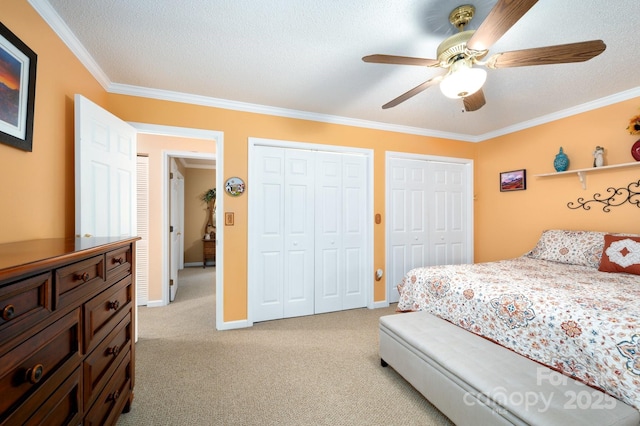 15 Heather Ln, Fairview, NC 28730 - bedroom with multiple closets, ornamental molding, carpet flooring, baseboards, and ceiling fan