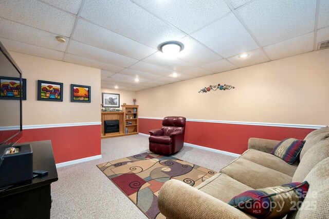 15 Heather Ln, Fairview, NC 28730 - carpeted living area with a paneled ceiling, a fireplace, and baseboards