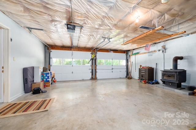 15 Heather Ln, Fairview, NC 28730 - garage with a garage door opener and a wood stove