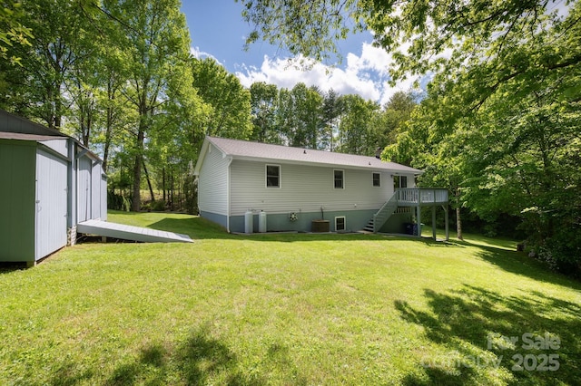 15 Heather Ln, Fairview, NC 28730 - back of property featuring stairs, a yard, a deck, and view of wooded area