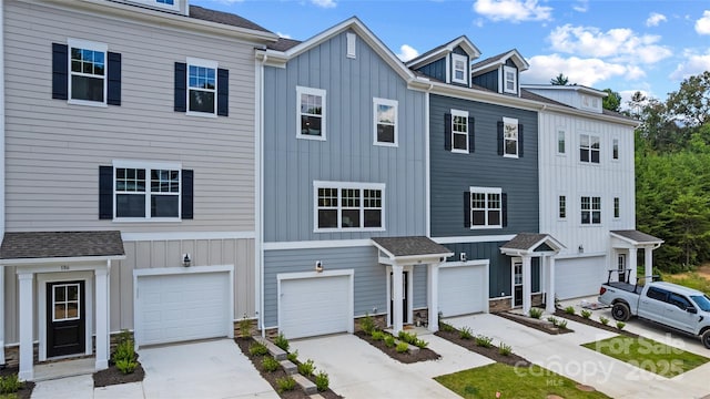 184 Cherry Springs Ln Unit 1-B, Asheville, NC 28804 - multi unit property with driveway, a garage, board and batten siding, and stone siding