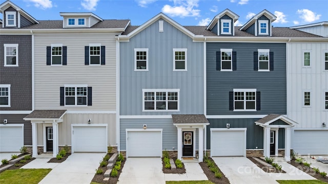 184 Cherry Springs Ln Unit 1-B, Asheville, NC 28804 - view of property with driveway, board and batten siding, and stone siding
