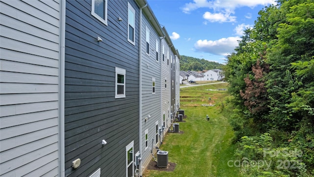 184 Cherry Springs Ln Unit 1-B, Asheville, NC 28804 - view of side of home with a central AC unit and a yard