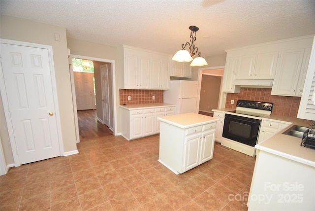 4704 Beech Crest Pl, Charlotte, NC 28269 - kitchen with freestanding refrigerator, light countertops, tasteful backsplash, and electric stove