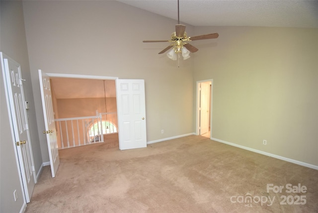 4704 Beech Crest Pl, Charlotte, NC 28269 - unfurnished bedroom with baseboards, carpet flooring, and high vaulted ceiling