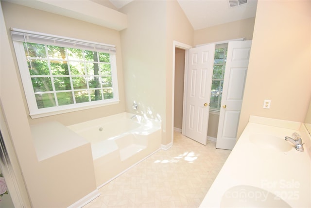 4704 Beech Crest Pl, Charlotte, NC 28269 - full bathroom featuring baseboards, visible vents, a sink, and a garden tub
