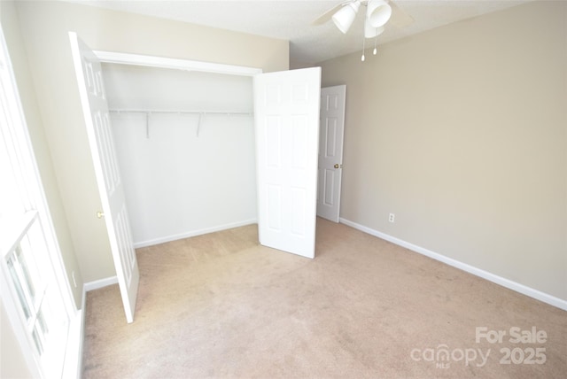 4704 Beech Crest Pl, Charlotte, NC 28269 - unfurnished bedroom with a closet, baseboards, and light carpet