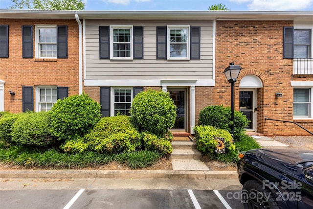 4605 Hedgemore Dr Unit I, Charlotte, NC 28209 - townhome / multi-family property featuring uncovered parking and brick siding
